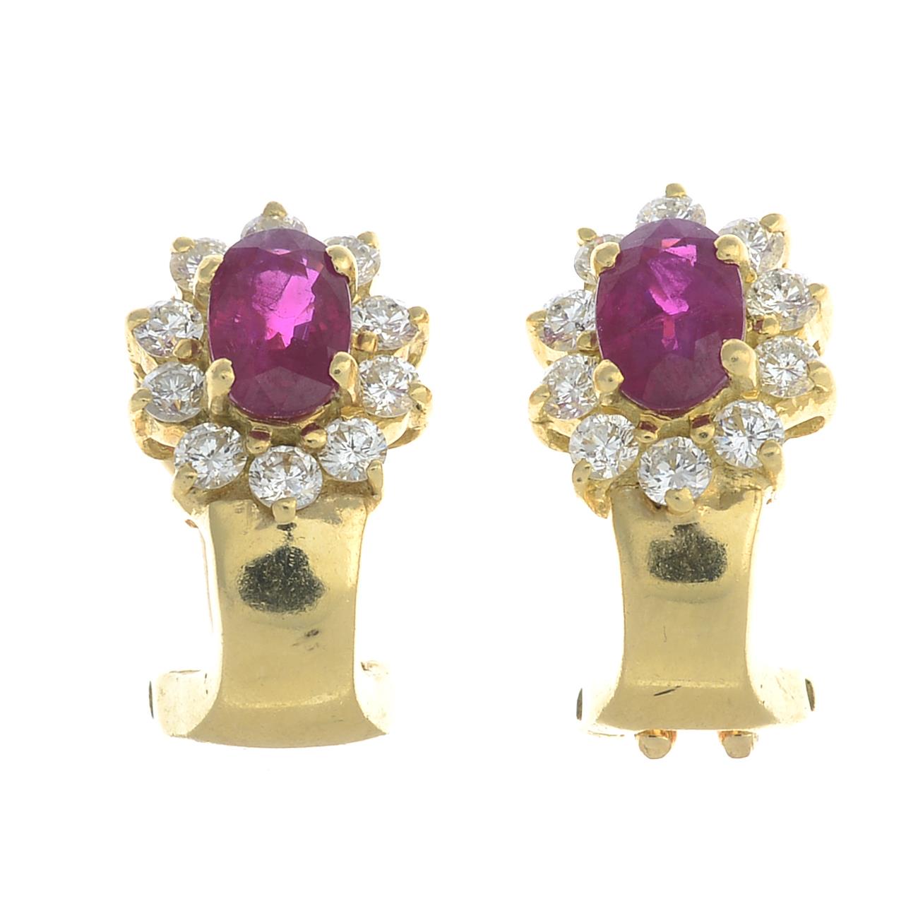 A pair of 18ct gold ruby and brilliant-cut diamond cluster earrings.Fittings for non-pierced