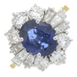 An 18ct gold sapphire and vari-cut diamond cluster ring.Sapphire calculated weight 1.49cts,