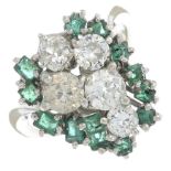 An old-cut diamond and emerald dress ring.Estimated total diamond weight 1.25cts,