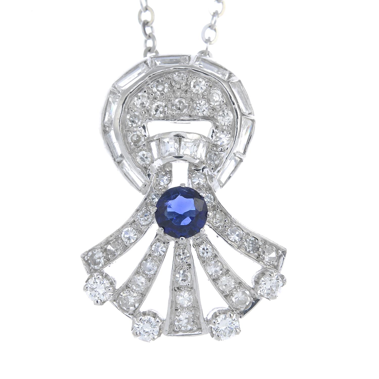 A sapphire and vari-cut diamond pendant,