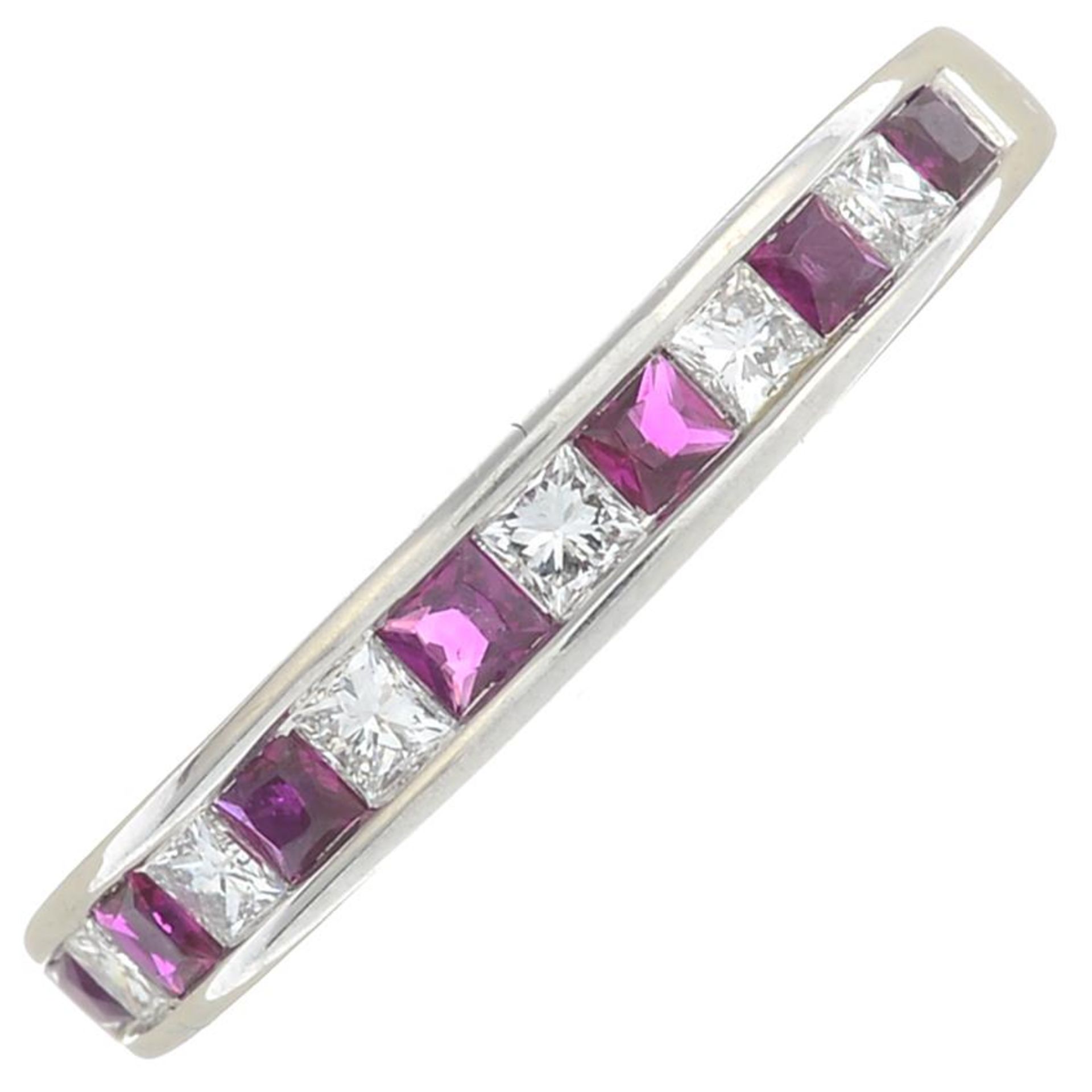 An 18ct gold ruby and diamond half eternity ring.Total ruby weight 0.63ct,