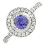 An 18ct gold tanzanite and diamond cluster ring.Total diamond weight 0.29ct,