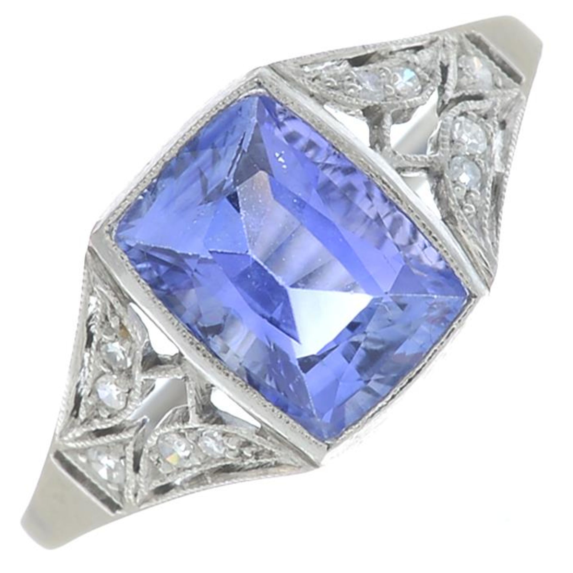A rectangular-shape sapphire and brilliant-cut diamond dress ring.Sapphire calculated weight