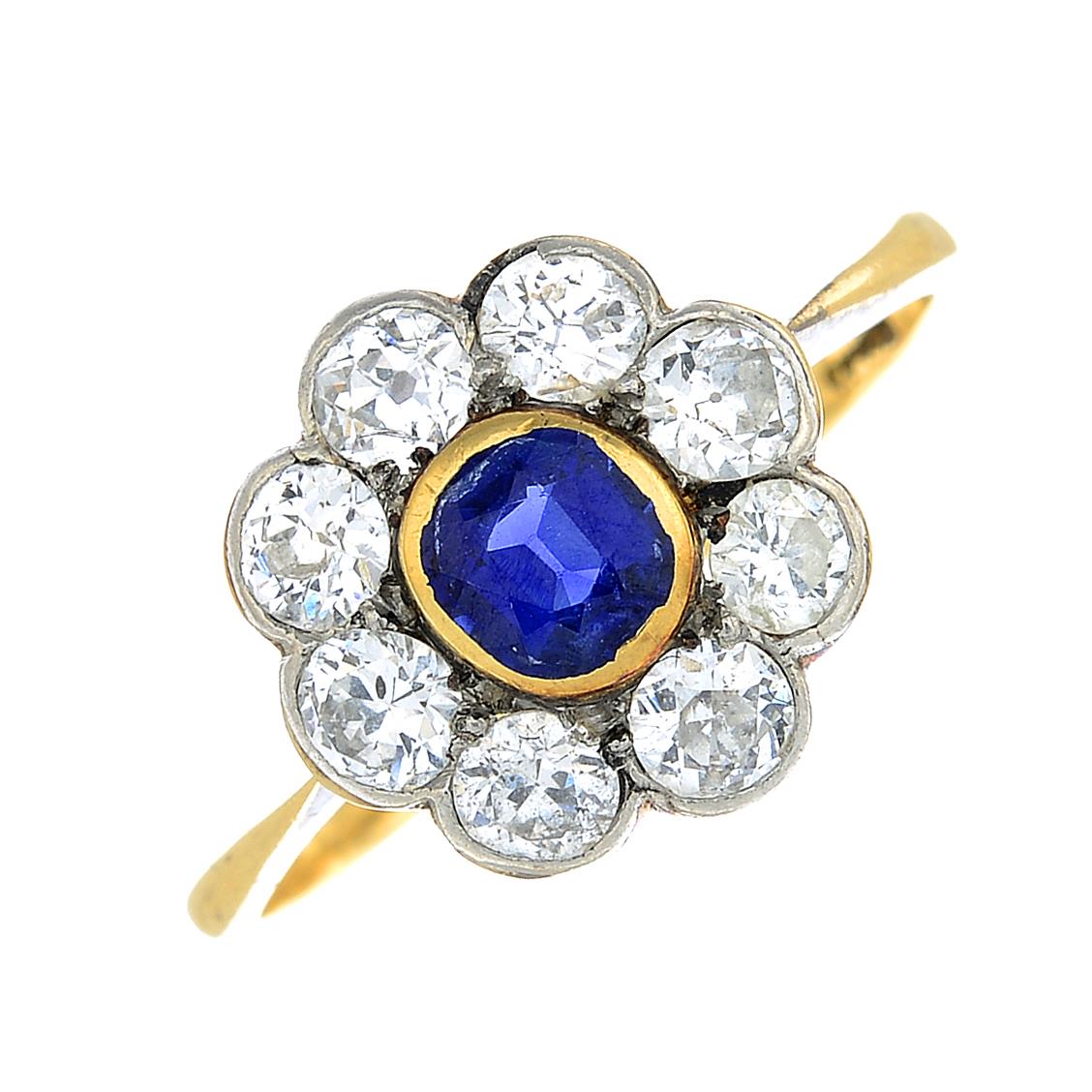 An early 20th century 18ct gold cushion-shape sapphire and vari-cut diamond floral cluster