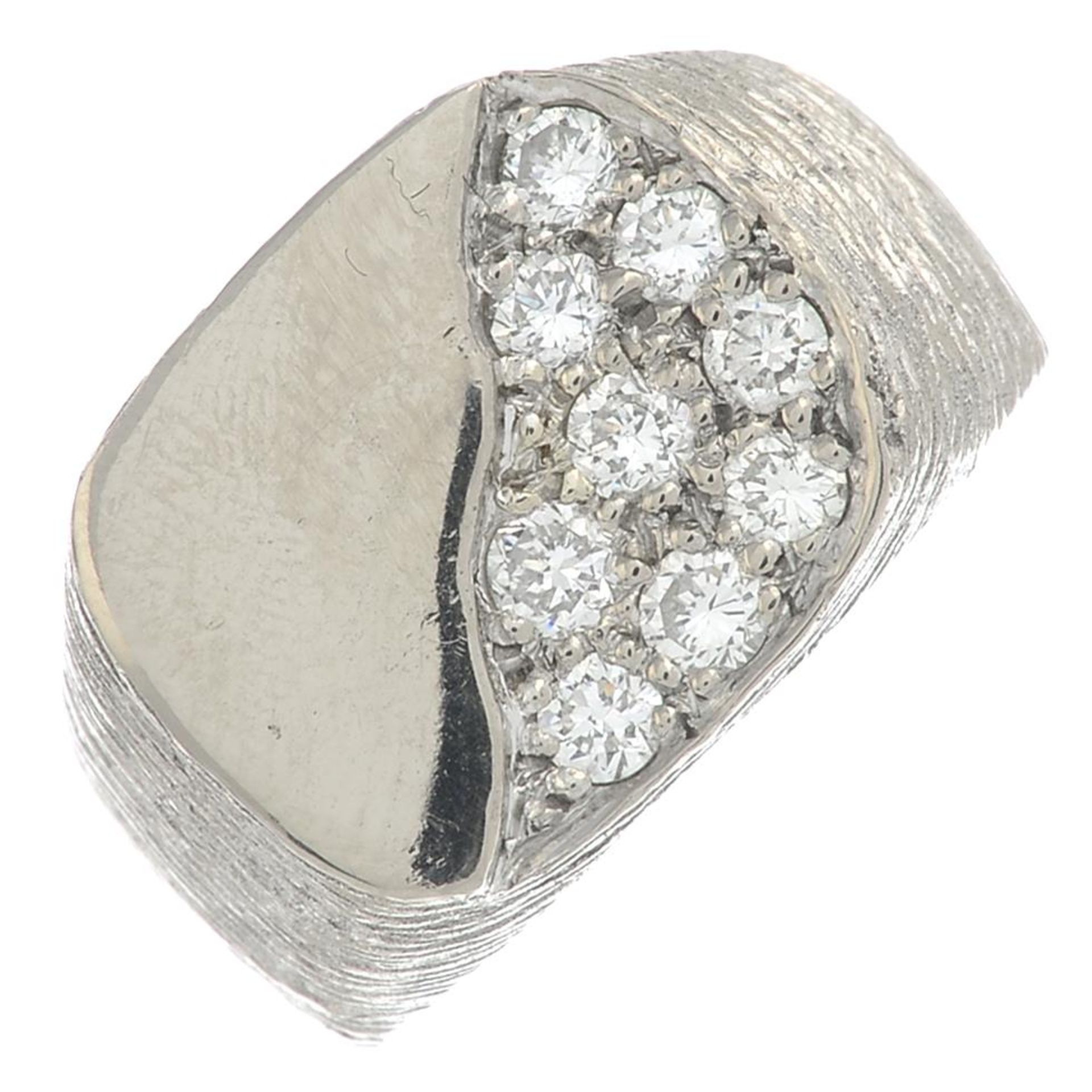 An 18ct gold and brilliant-cut diamond signet ring.Estimated total diamond weight 0.65ct,