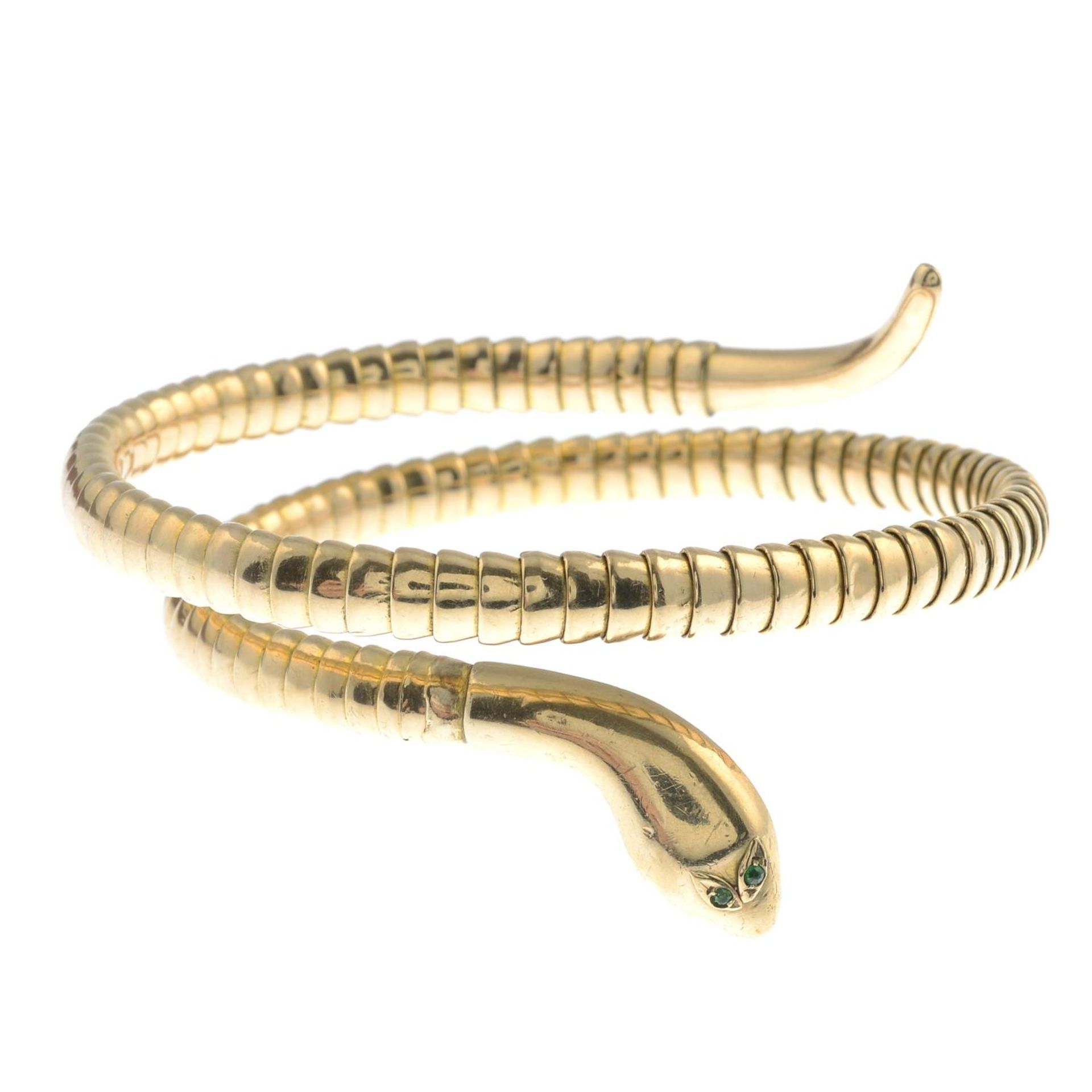 An early 20th century 9ct gold snake bangle.Stamped 9CT.Approximate inner diameter 5.5cms.