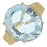 An 18ct gold oval-shape aquamarine and brilliant-cut diamond dress ring.Aquamarine calculated