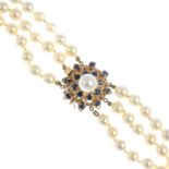 A cultured pearl three-row necklace, with sapphire and cultured pearl cluster clasp.