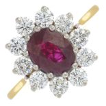 An 18ct gold ruby and brilliant-cut diamond cluster ring.Ruby calculated weight 1.38cts,