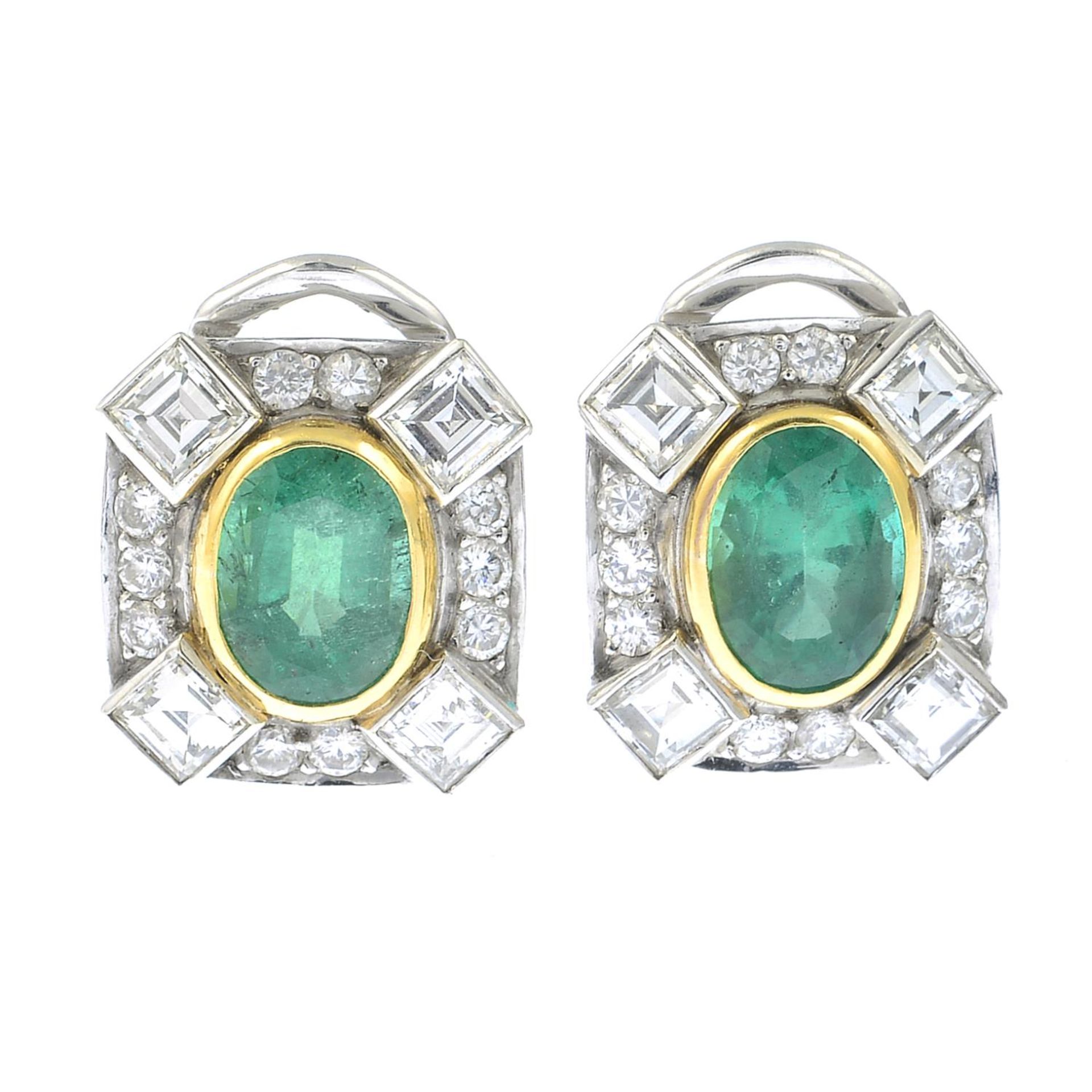 A pair of oval-shape emerald and vari-cut diamond earrings.Emerald calculated weights 0.92ct and