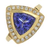 An 18ct gold tanzanite and brilliant-cut diamond cluster ring.Tanzanite weight 2.22cts.Estimated