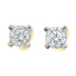 A pair of brilliant-cut diamond stud earrings.Total diamond weight 0.62ct,