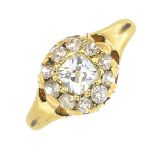 An early 20th century gold old-cut diamond cluster ring.Estimated total diamond weight 0.90ct,