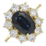 A sapphire and brilliant-cut diamond cluster ring.Sapphire calculated weight 1.80cts,