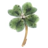 A carved nephrite jade and brilliant-cut diamond flower brooch.Estimated total diamond weight