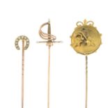 Twelve late 19th to early 20th century mostly gem-set stick pins.To include a sword,