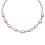 An oval-shape pink paste and brilliant-cut diamond necklace.Estimated dimensions of one pink paste