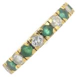 An 18ct gold circular-shape emerald and brilliant-cut diamond full eternity ring.Estimated total