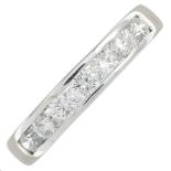 An 18ct gold brilliant-cut diamond half eternity ring.Estimated total diamond weight 1ct,