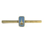 A mid 20th century 9ct gold enamel tiepin,