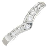 A platinum brilliant-cut diamond chevron band ring.Estimated total diamond weight 0.35ct,