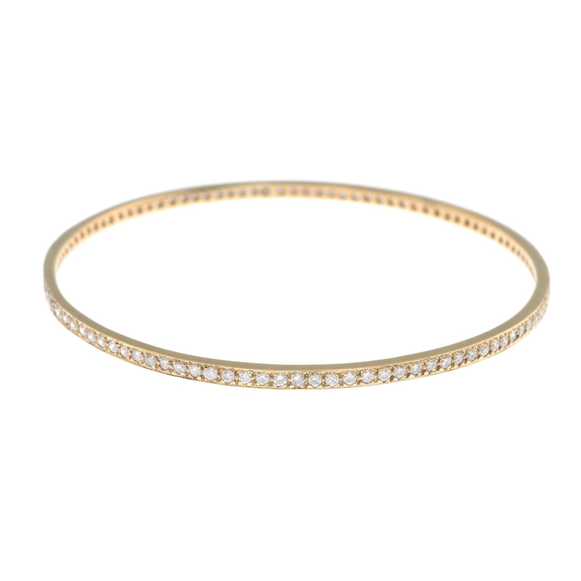 An 18ct gold brilliant-cut diamond bangle.Estimated total diamond weight 2cts,