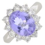 A tanzanite and brilliant-cut diamond cluster ring.Tanzanite calculated weight 1.95cts,