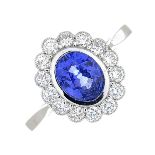 A sapphire and brilliant-cut diamond cluster ring.Sapphire calculated weight 1.56cts,