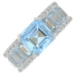 A vari-cut topaz and brilliant-cut diamond dress ring.Principal square-shape topaz calculated