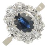 An oval-shape sapphire and brilliant-cut diamond cluster ring.Sapphire calculated weight 1.25cts,