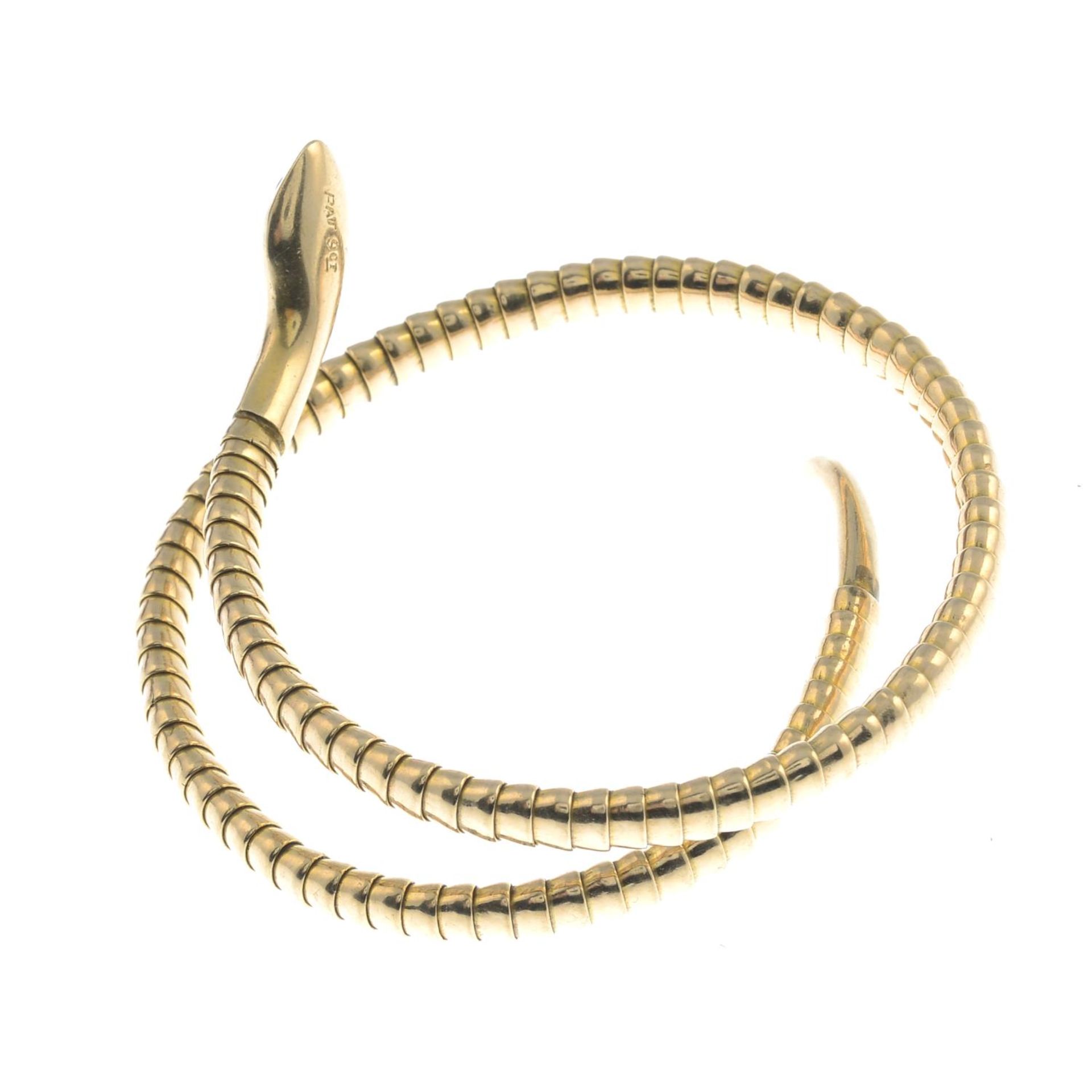 An early 20th century 9ct gold snake bangle.Stamped 9CT.Approximate inner diameter 5.5cms. - Bild 2 aus 2