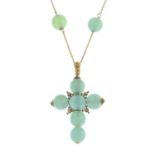 A green paste cross pendant,