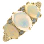 A late 19th century gold opal three-stone ring with rose-cut diamond accents.Ring size Q.
