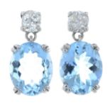 A pair of 18ct gold oval-shape aquamarine and old-cut diamond earrings.Aquamarine calculated