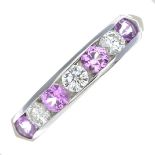 An 18ct gold pink sapphire and diamond half eternity ring.Estimated total diamond weight