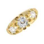 An early 20th century 18ct gold old-cut diamond three-stone ring.Estimated total diamond weight