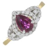 An 18ct gold ruby and brilliant-cut diamond dress ring.Ruby calculated weight 0.87ct,