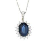 A sapphire and diamond cluster pendant,