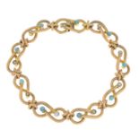 An early 20th century 15ct gold split pearl and turquoise bracelet.Stamped 15ct.Length 20cms.