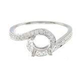 A brilliant-cut diamond ring mount.Estimated total diamond weight 0.35ct.Stamped 750.Ring size