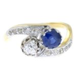 A mid 20th century gold sapphire and old-cut diamond crossover ring.Estimated total diamond weight