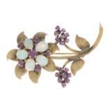 A mid 20th century opal and ruby floral brooch.