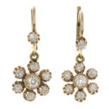 A pair of old-cut diamond cluster earrings.Estimated total diamond weight 1.15cts,