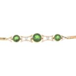 An early 20th century 15ct gold green tourmaline and diamond bracelet.Principal tourmaline