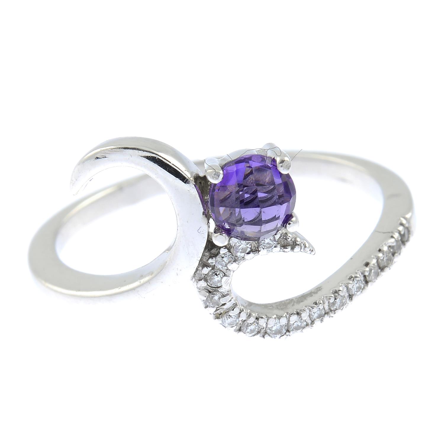 An amethyst and diamond dress ring.Ring size L.