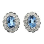 A pair of 18ct gold aquamarine and brilliant-cut diamond earrings.Estimated total diamond weight