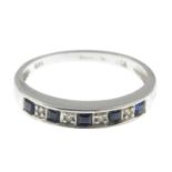 A 9ct gold sapphire and diamond half eternity ring.Hallmarks for 9ct gold, partially indistinct.