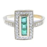 An emerald and diamond dress ring.Estimated total diamond weight 0.30ct.