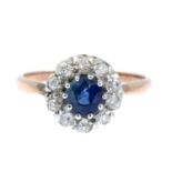 A sapphire and old-cut diamond cluster ring.Estimated total diamond weight 0.50ct,