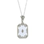An early 20th century gold rock crystal and diamond pendant,